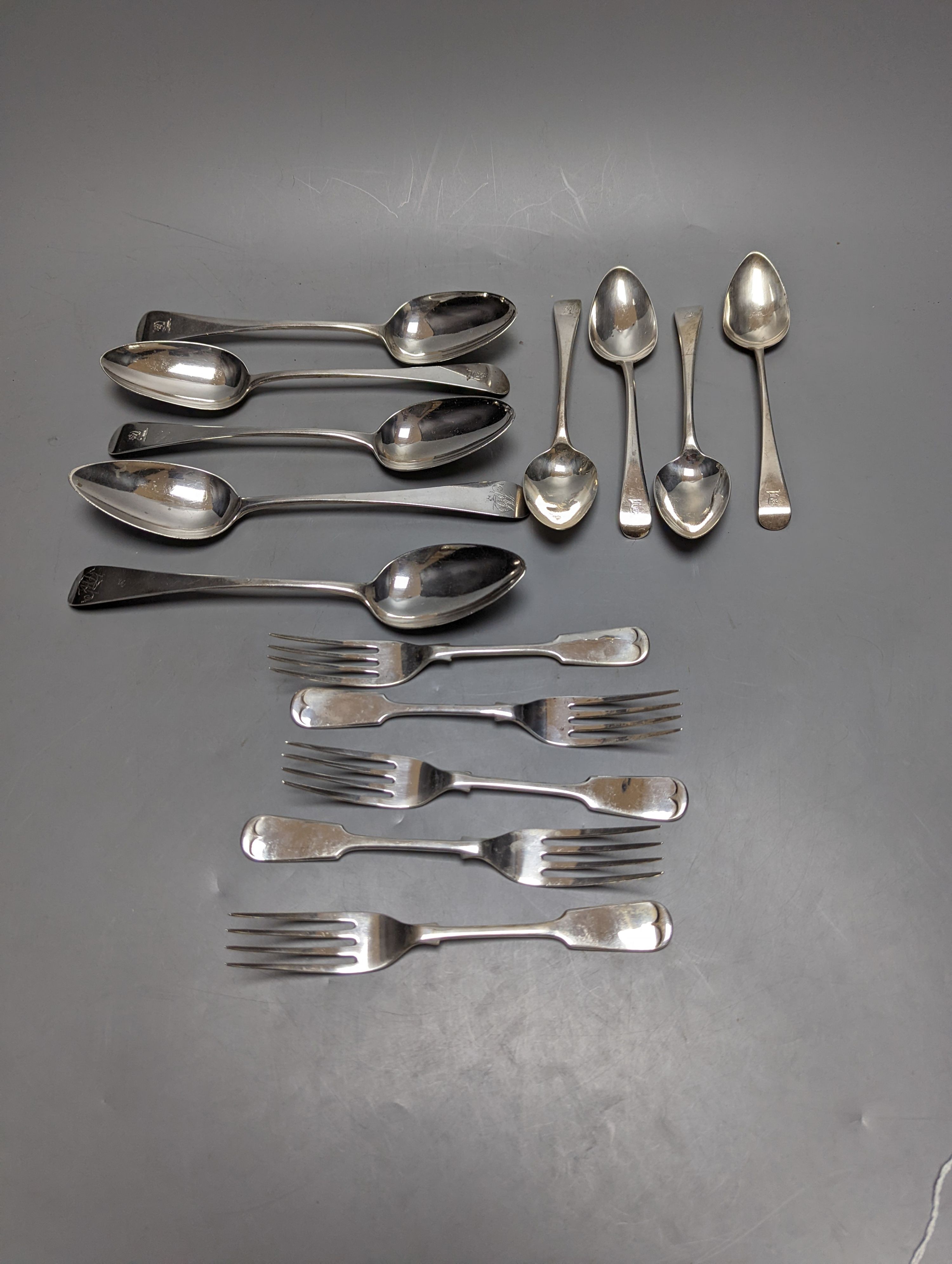 Fourteen items of 19th century and later silver flatware, various patterns, dates and maker's including three tablespoons by Eley & Fearn, London, 1817, 23oz.